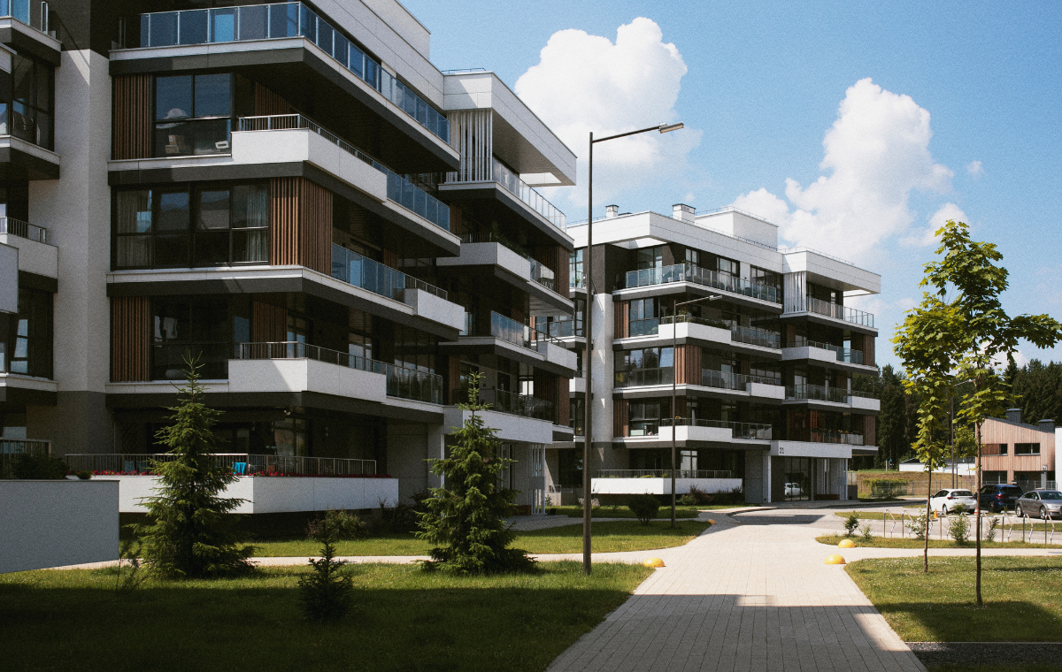 Modern apartment buildings with multiple floors, large windows, and balconies, surrounded by a landscaped area with small trees and a paved walkway
